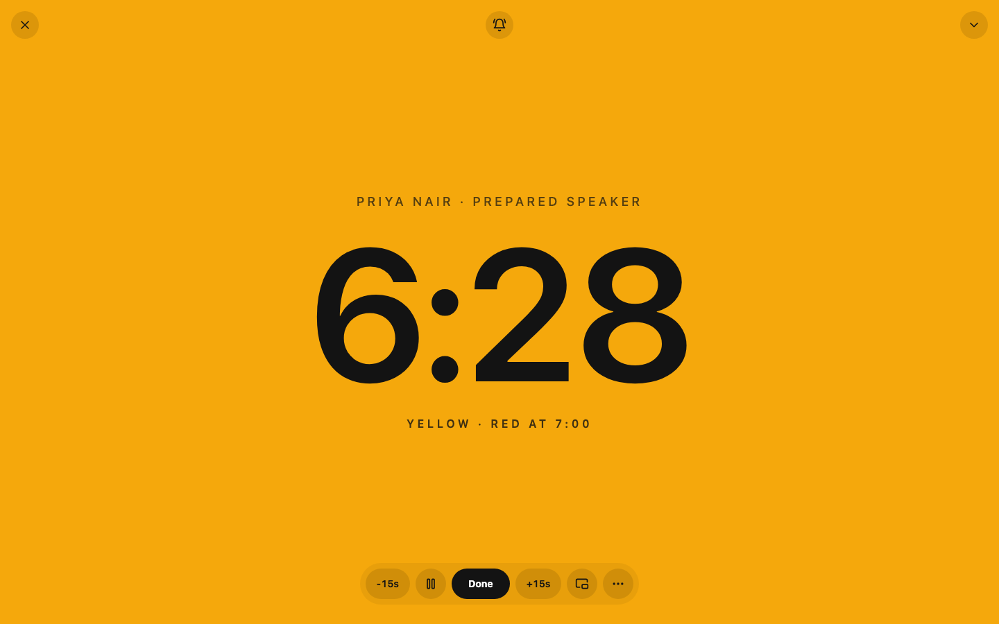 A full-screen yellow timing signal for fictional prepared speaker Priya Nair at 6 minutes 28 seconds.